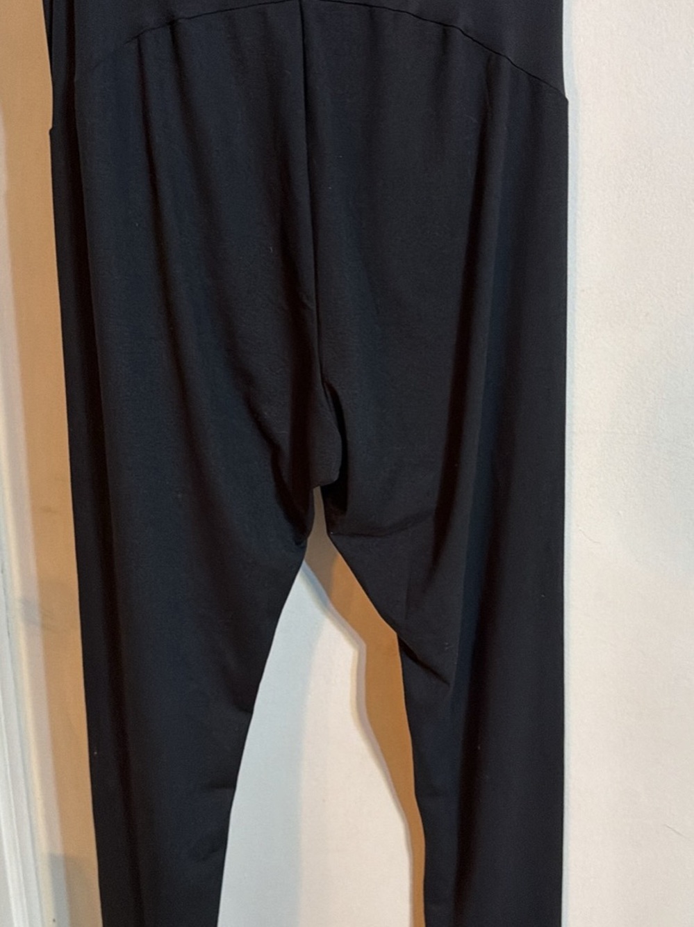 Felina black garment with purple logo tag
